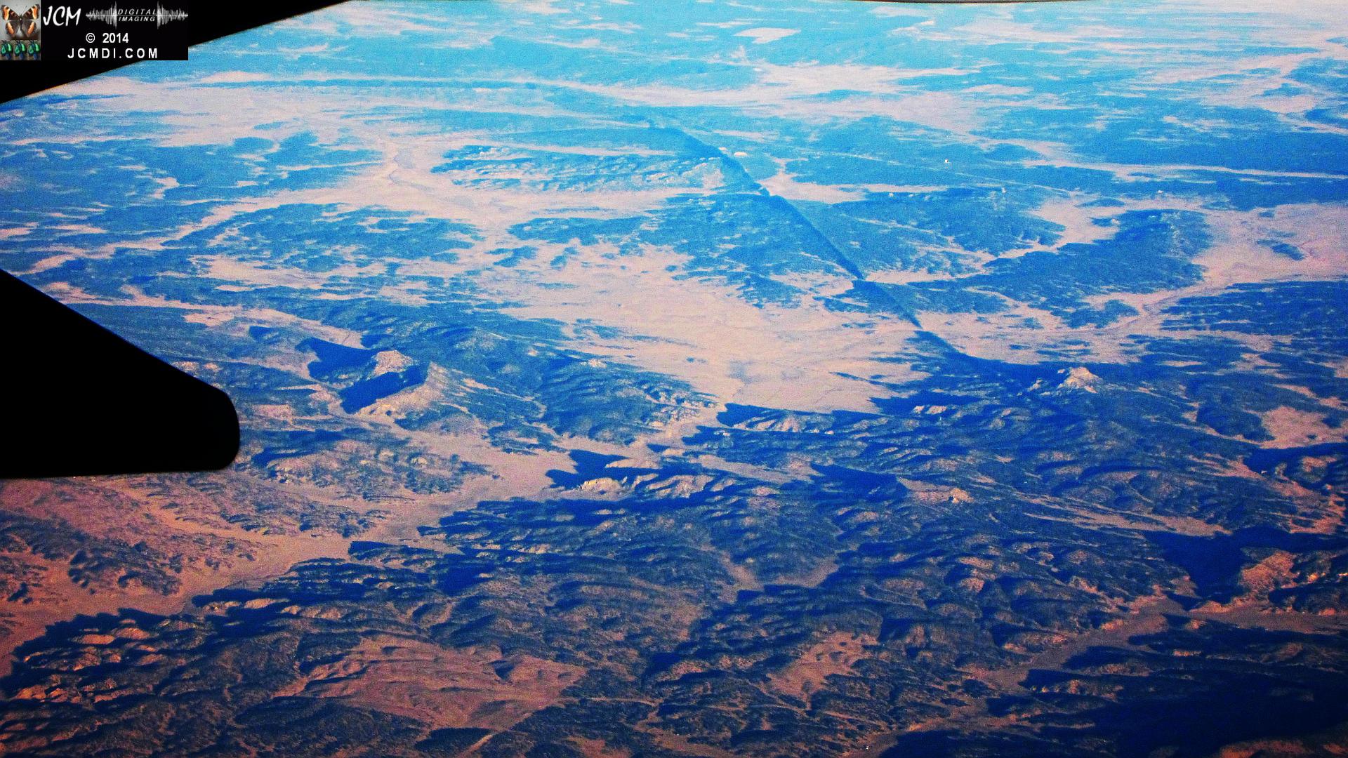 Aerial view of long straight ridge in desert from 34000 feet